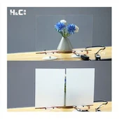 LCD-film med selvklæbende påføres på det udgående glas